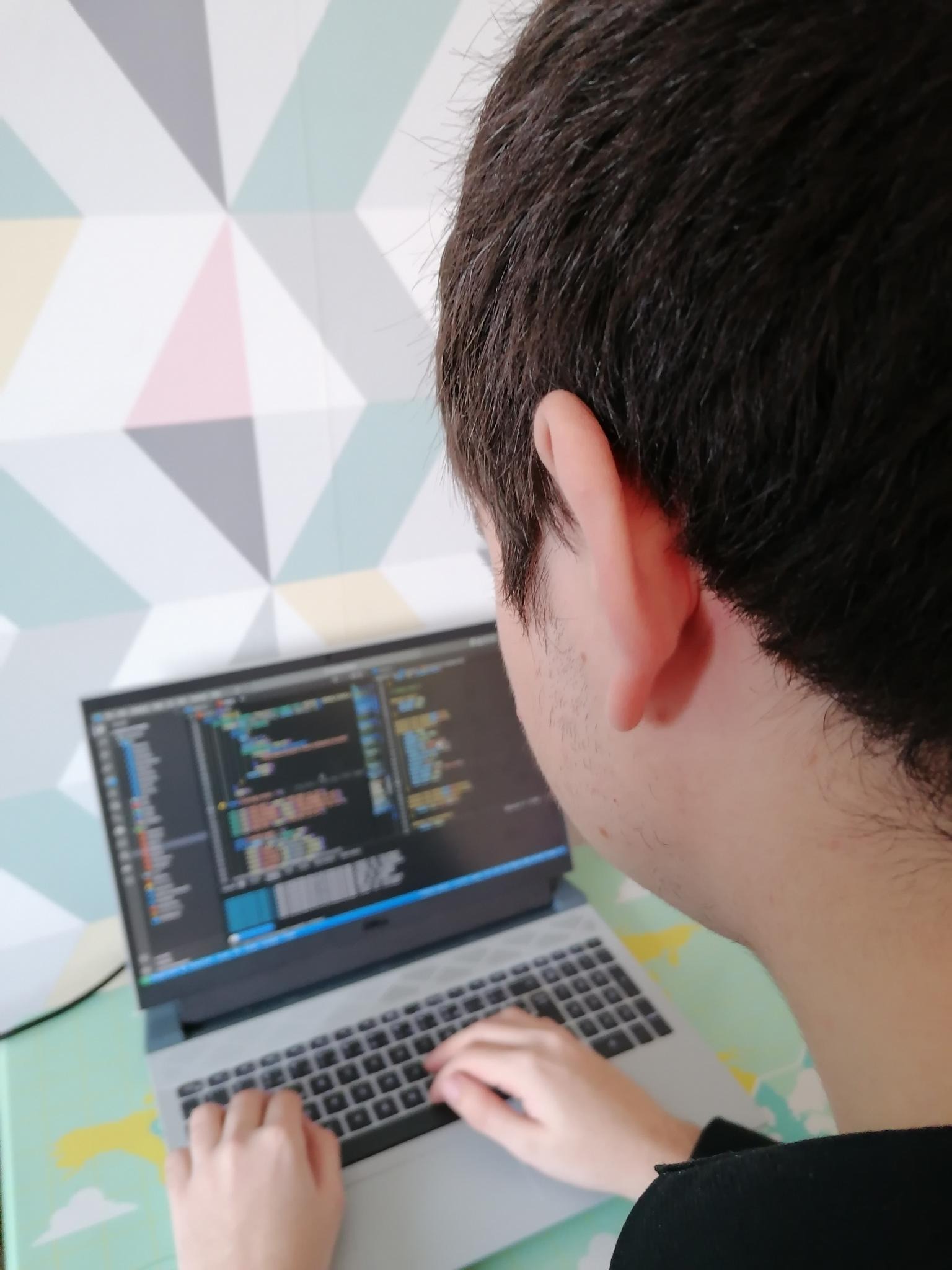 Photo of Joshua working on his computer.